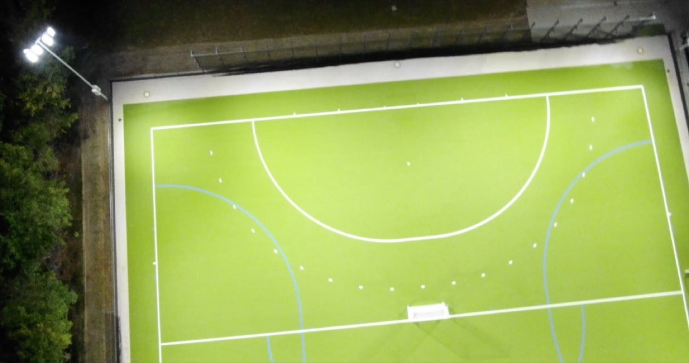 Hockey pitch at night with LED floodlighting